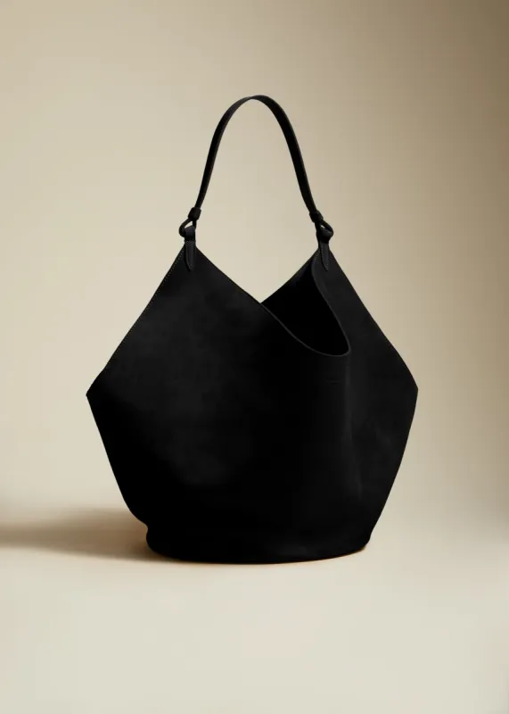 The Medium Lotus Tote in Black Suede sold by KHAITE