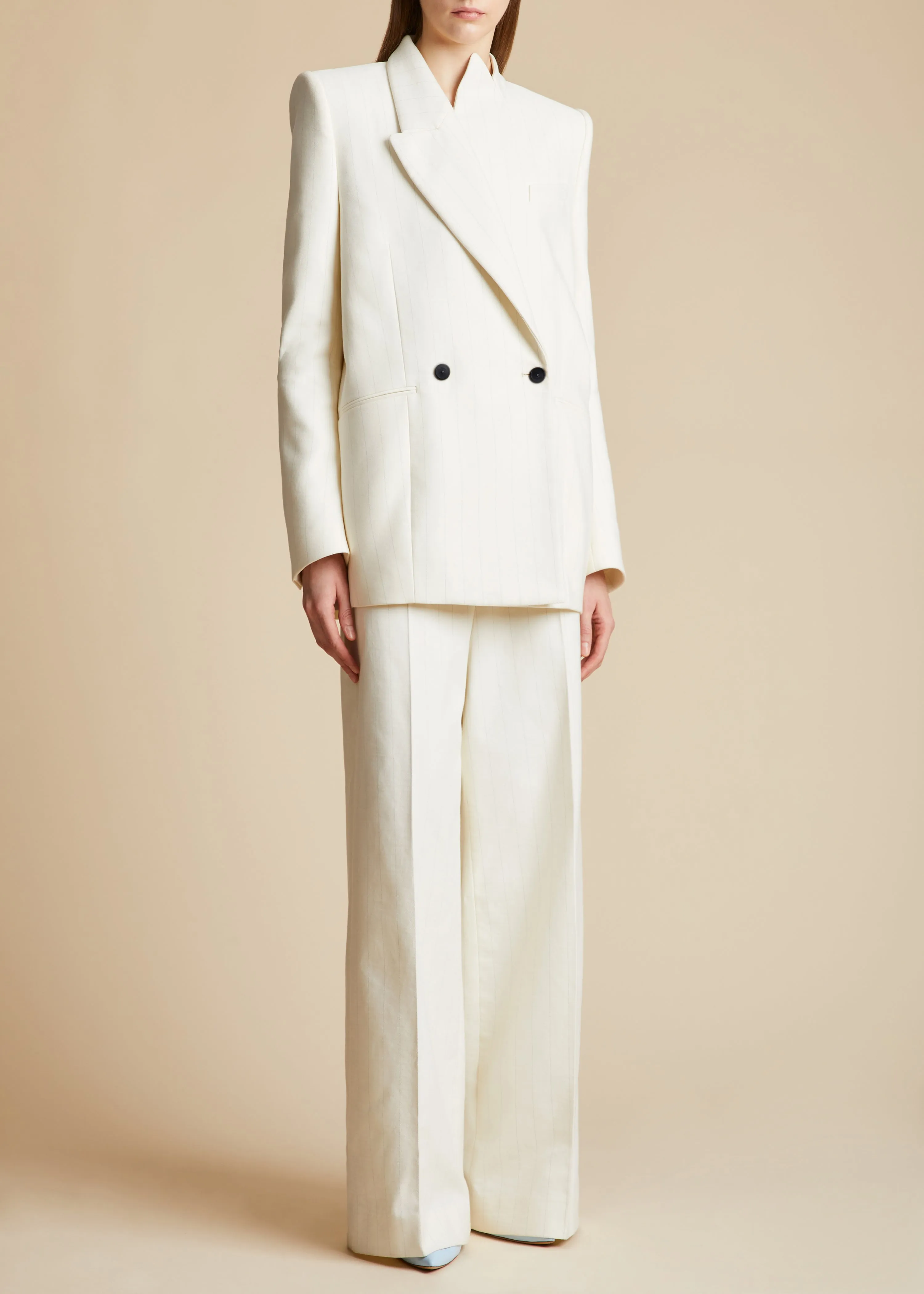 The Banton Pant in Cream with Black Stripes sold by KHAITE