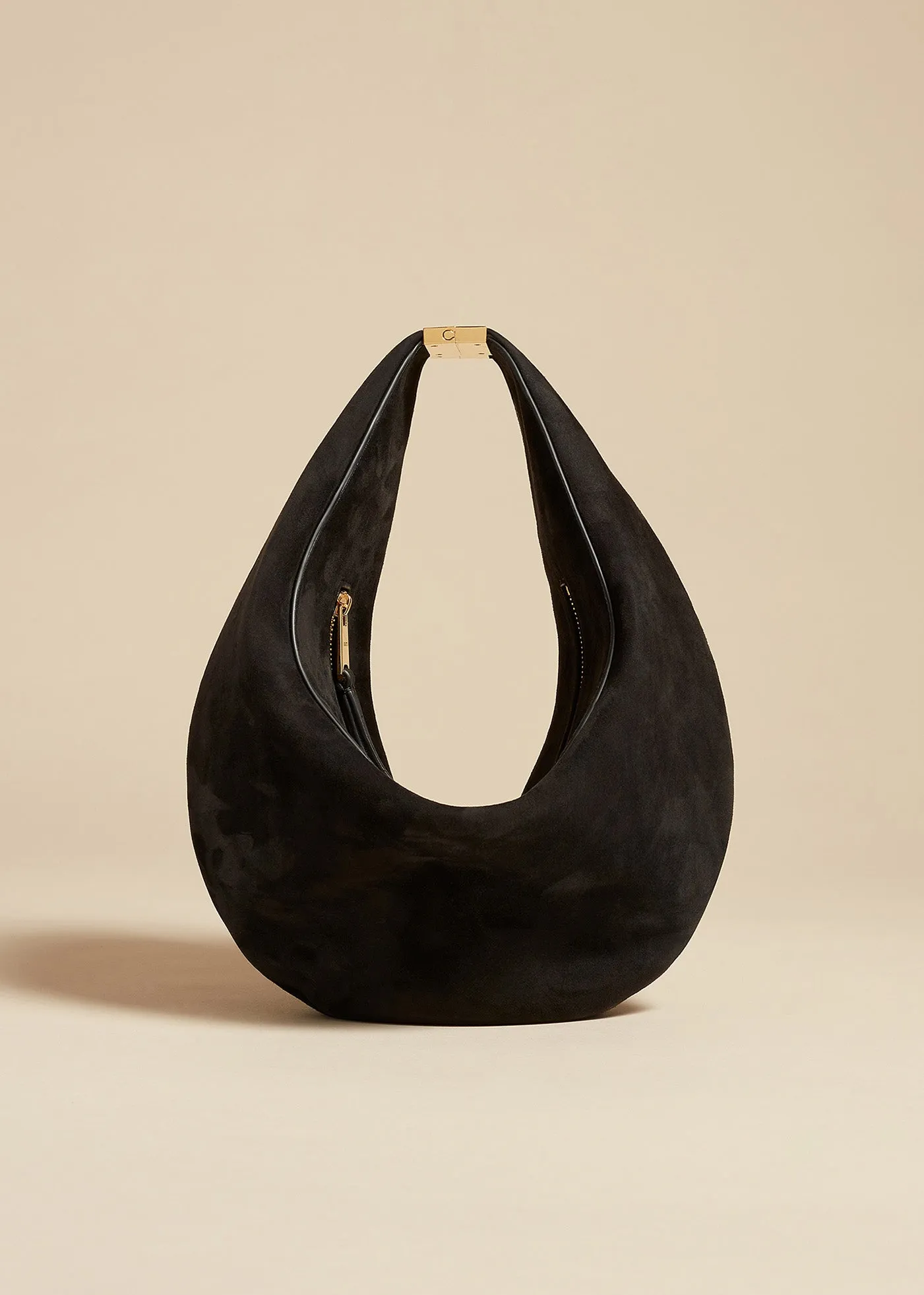 The Small Olivia Hobo with Hardware in Black Suede sold by KHAITE