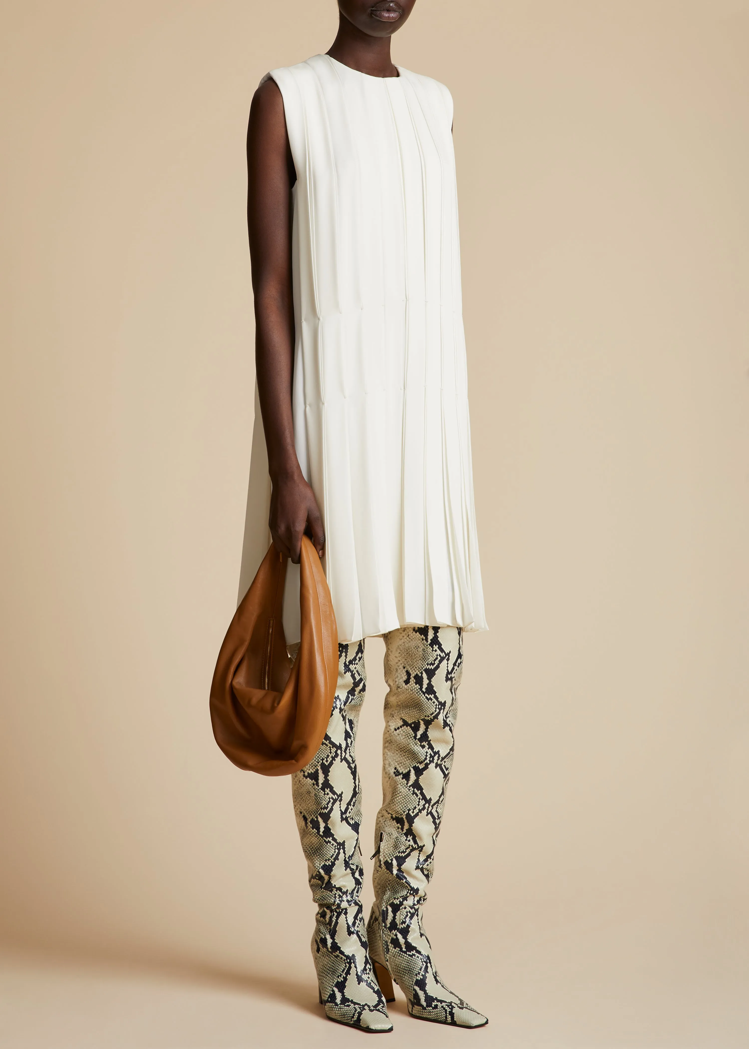 The Blaz Dress in Cream sold by KHAITE
