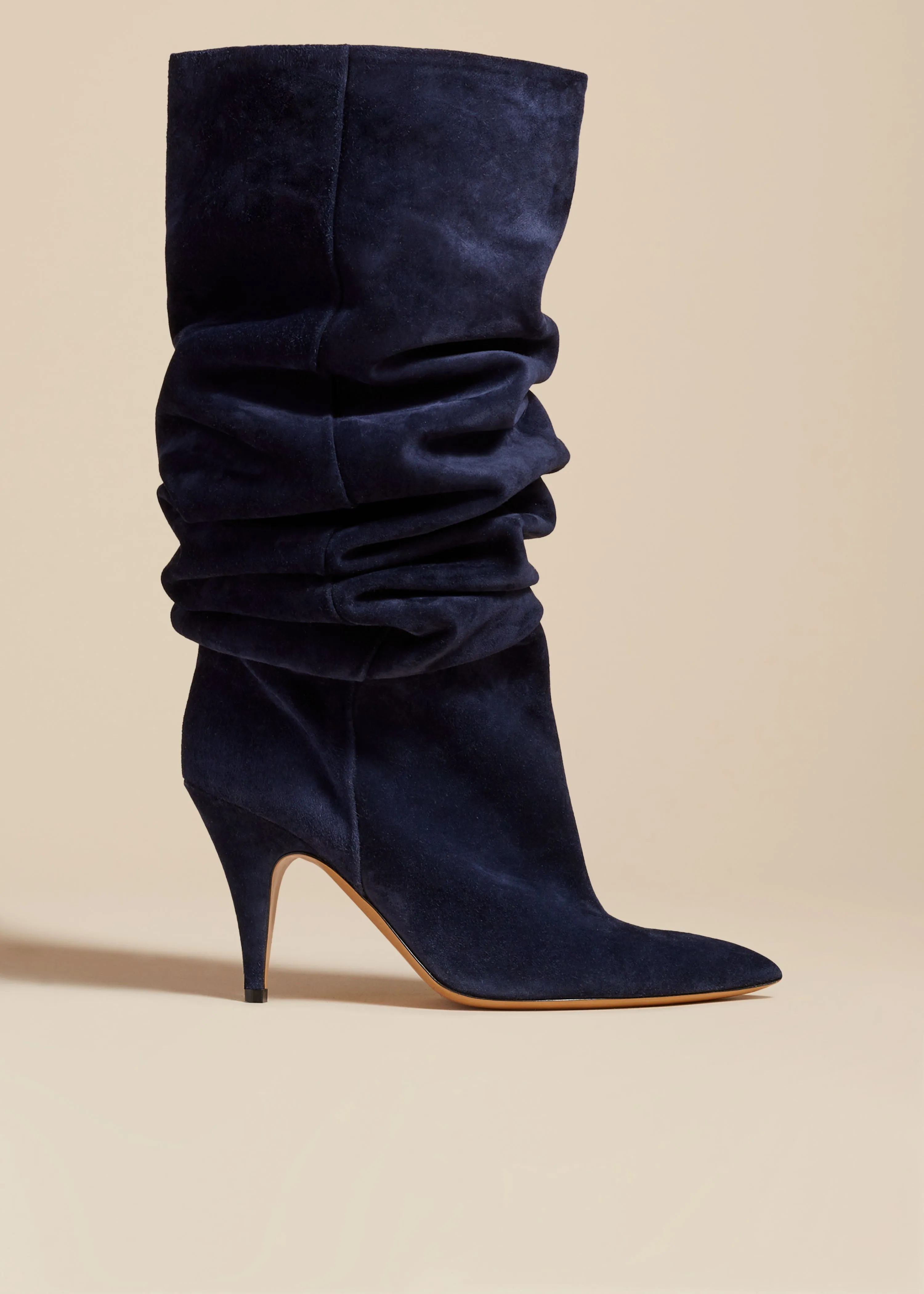 The River Knee-High Boot in Midnight Suede sold by KHAITE