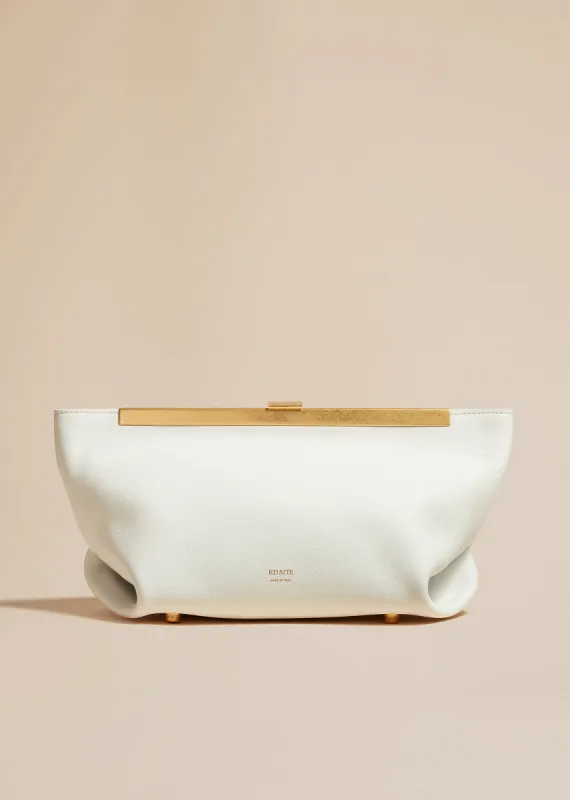 The Aimee Clutch in Optic White Leather sold by KHAITE