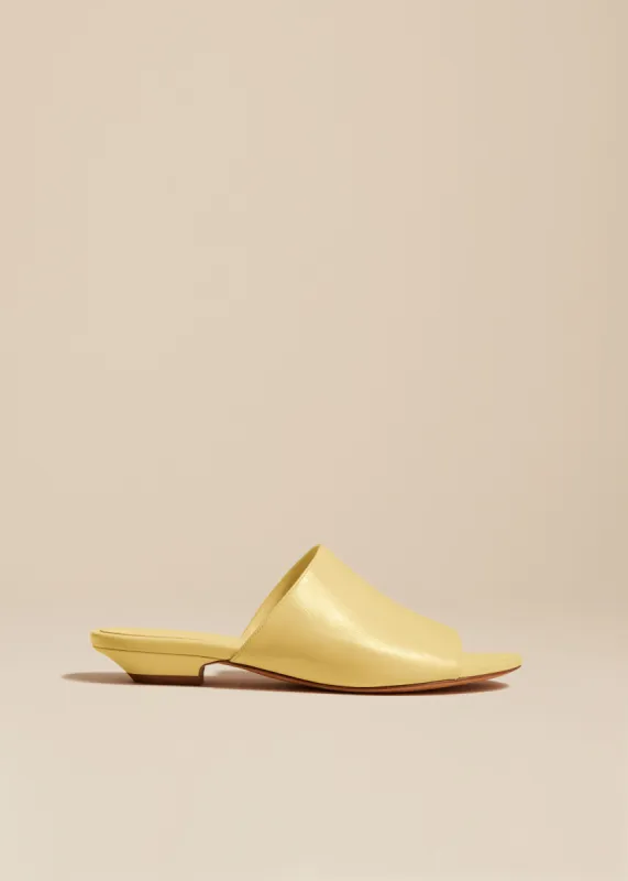 The Marion Slide in Pale Yellow Leather sold by KHAITE