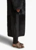 Lolo Shearling Coat in Black sold by KHAITE