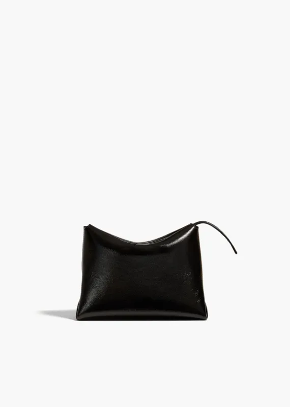 Lina Pochette in Black Crackle Patent Leather sold by KHAITE
