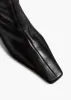 Ona Knee-High Boot in Black Glazed Leather sold by KHAITE