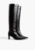 Ona Knee-High Boot in Black Glazed Leather sold by KHAITE