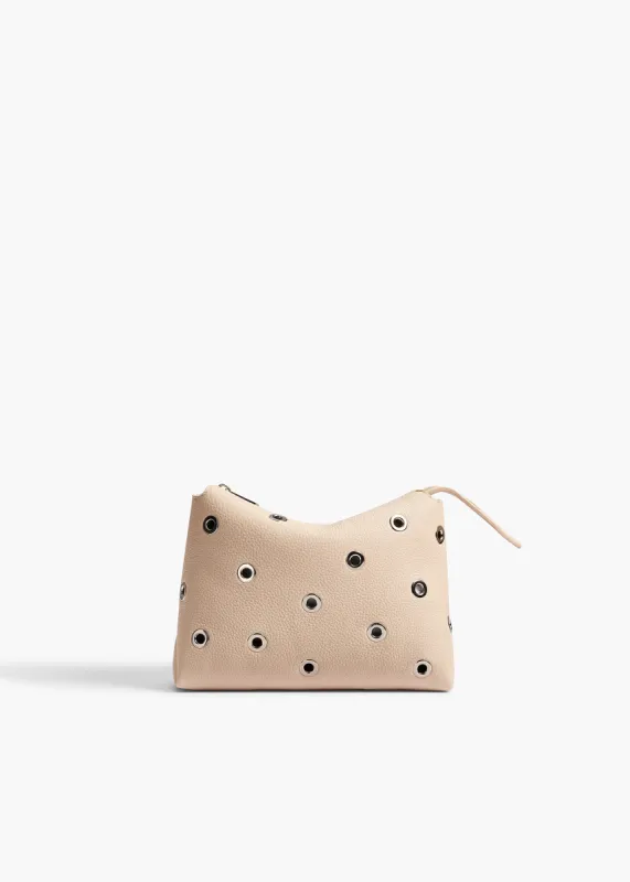 Lina Pochette in Dark Ivory Pebbled Leather with Grommets sold by KHAITE