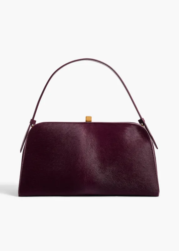 Cate Bag in Eggplant Haircalf sold by KHAITE