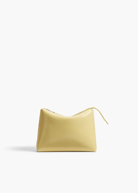 Lina Pochette in Pale Yellow Crackle Patent Leather sold by KHAITE