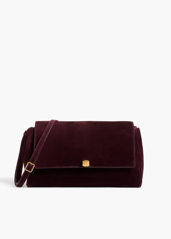 Audrey Crossbody Bag in Eggplant Suede sold by KHAITE