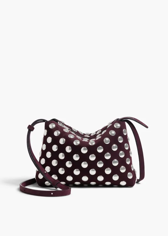 Lina Crossbody Bag in Rouge Noir Suede with Silver Studs sold by KHAITE