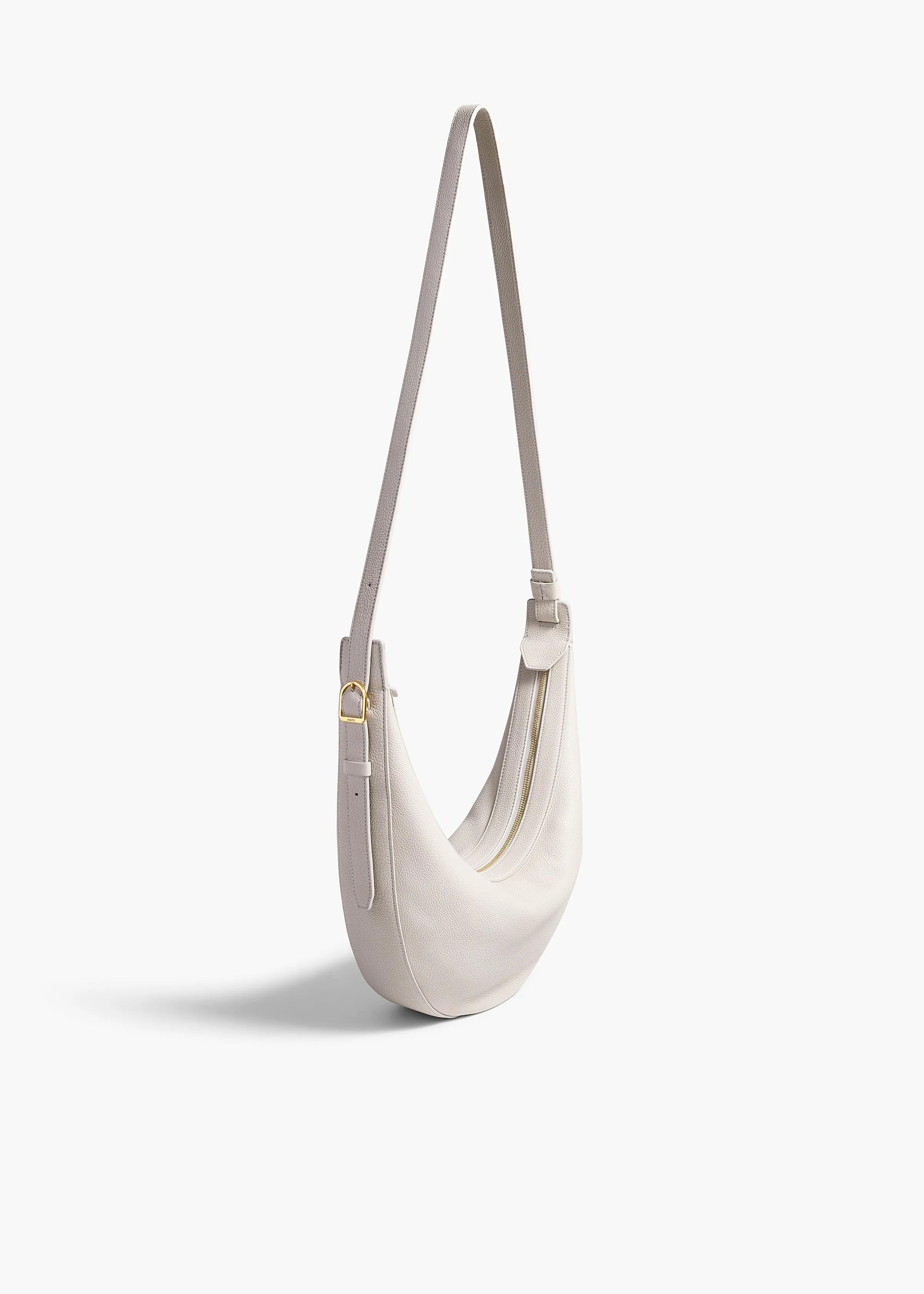 Small Augustina Crossbody Bag in Light Grey Pebbled Leather sold by KHAITE