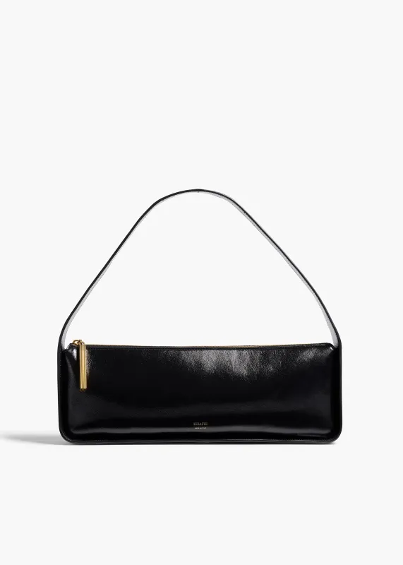 Lori Baguette Bag in Black Crackle Patent Leather sold by KHAITE