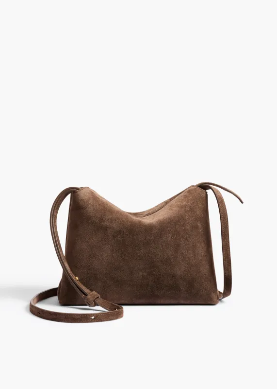 Lina Crossbody Bag in Cedar Suede sold by KHAITE