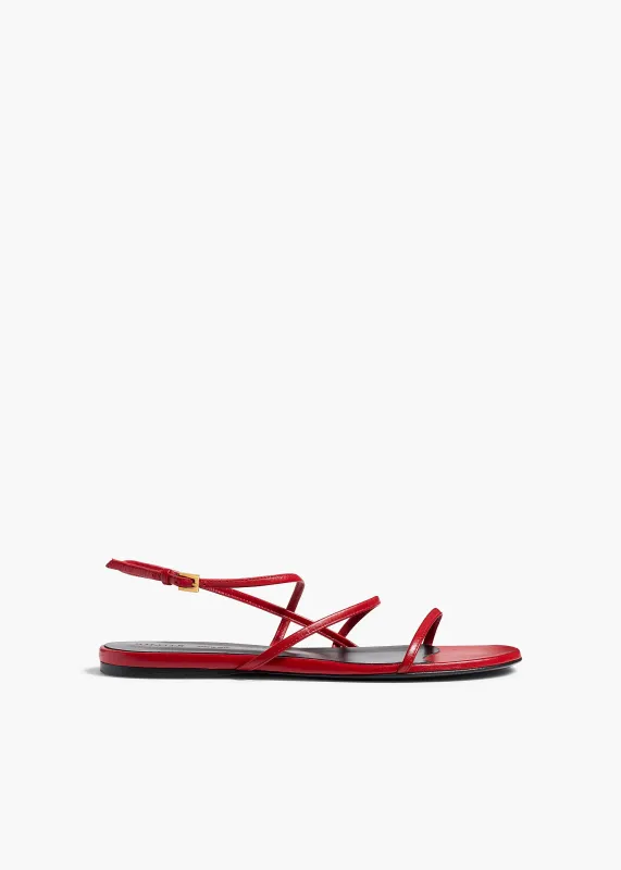 Loop Flat Sandal in Rebel Leather sold by KHAITE