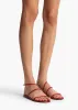 Loop Flat Sandal in Rebel Leather sold by KHAITE