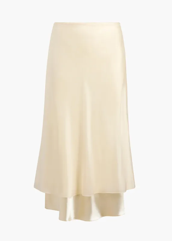 Monina Skirt in Cream sold by KHAITE