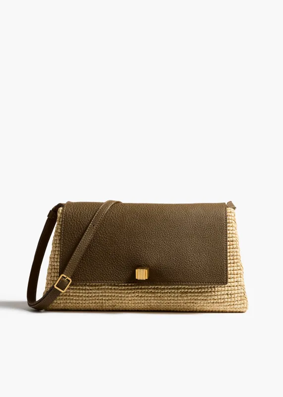 Audrey Crossbody Bag in Natural Raffia and Olive Leather sold by KHAITE