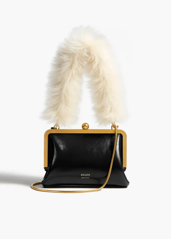 Small Lilith Evening Bag in Black Crackle Patent Leather with Detachable Shearling Handle sold by KHAITE