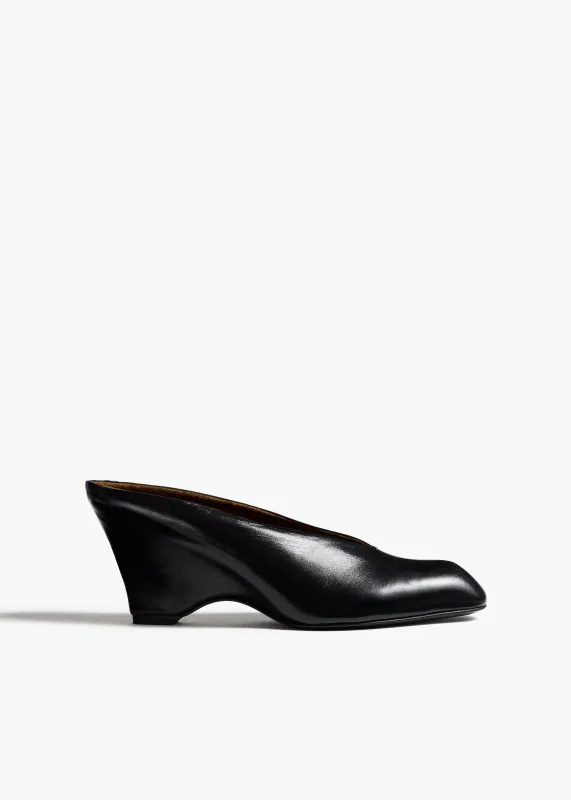 Colt Wedge in Black Glazed Leather sold by KHAITE