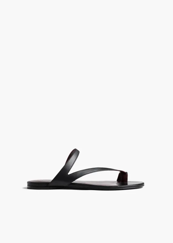 Aimee Flat Sandal in Black Leather sold by KHAITE