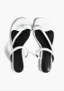 Aimee Flat Sandal in Optic White Leather sold by KHAITE