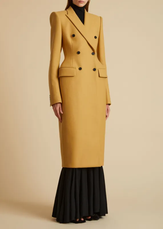 The Carmona Coat in Camel sold by KHAITE