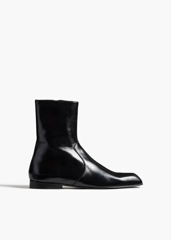 Colt Ankle Boot in Black Glazed Leather sold by KHAITE