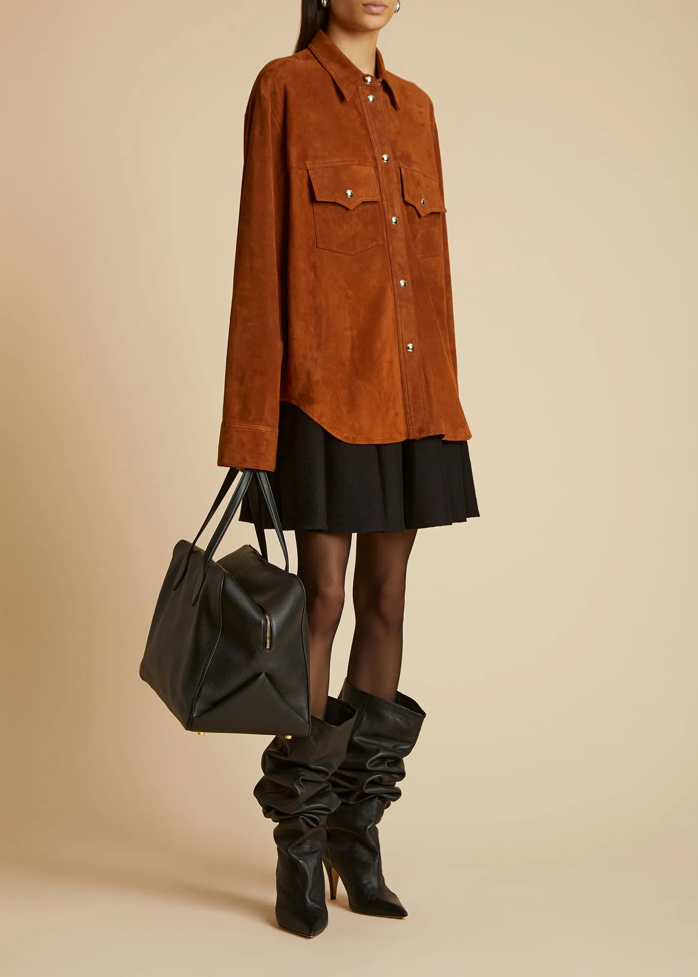 The Ulli Skirt in Black sold by KHAITE