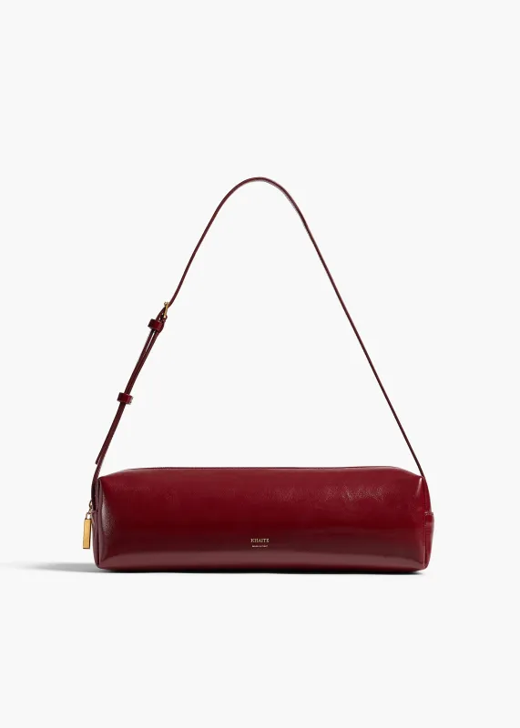 Kye Shoulder Bag in Oxblood Crackle Patent Leather sold by KHAITE