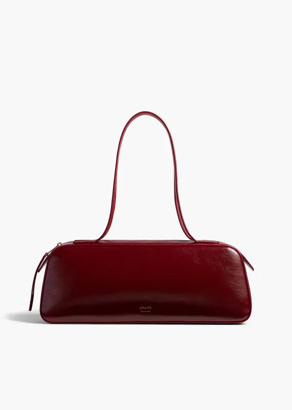 Simona Shoulder Bag in Oxblood Crackle Patent Leather sold by KHAITE