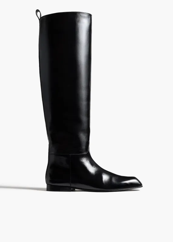Colt Knee-High Boot in Black Glazed Leather sold by KHAITE
