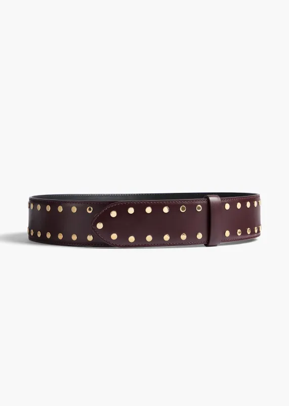 Theo Waist Belt in Bordeaux Leather with Gold Studs sold by KHAITE