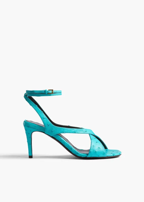 Liria Ankle Strap Sandal in Crystal Blue Ostrich sold by KHAITE