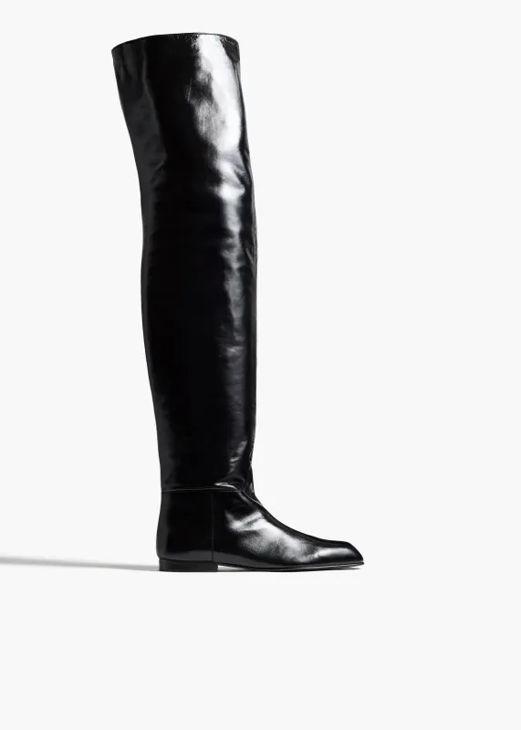 Colt Over-the-Knee Boot in Black Glazed Leather sold by KHAITE