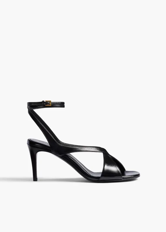 Liria Ankle Strap Sandal in Black Glazed Leather sold by KHAITE
