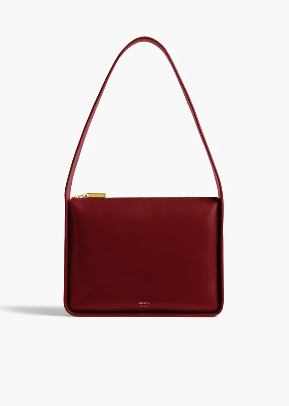 Lori Squared Bag in Oxblood Crackle Patent Leather sold by KHAITE