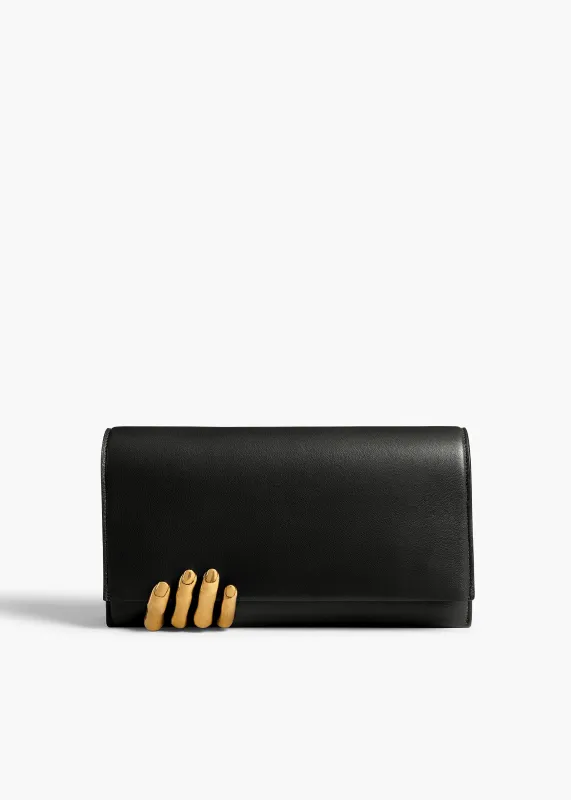 Sculpted Hand Clutch in Black Leather sold by KHAITE