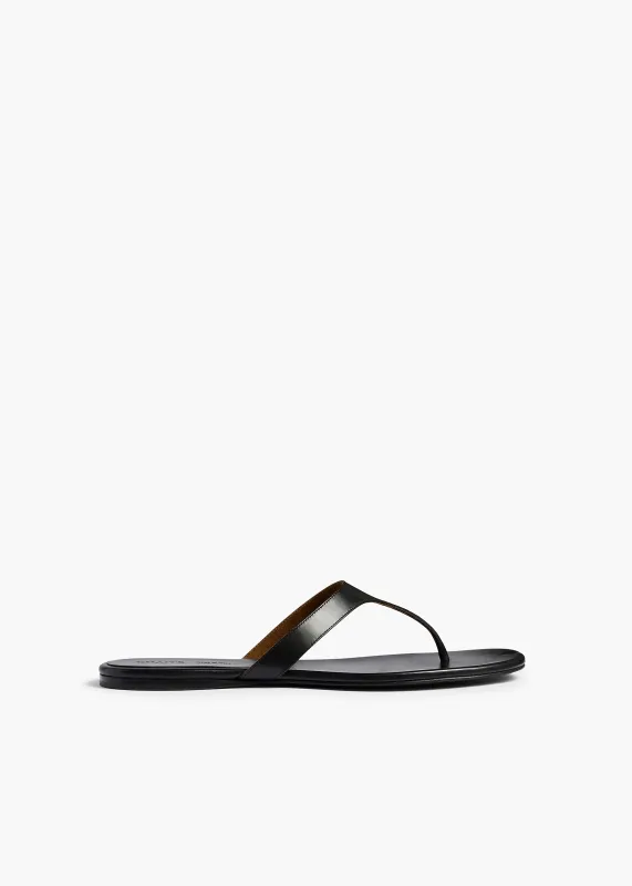 Archer Flat Sandal in Black Leather made by KHAITE