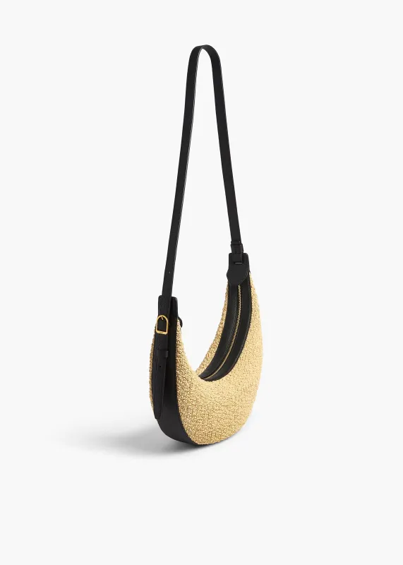 Small Augustina Crossbody Bag in Natural Raffia and Black Leather made by KHAITE