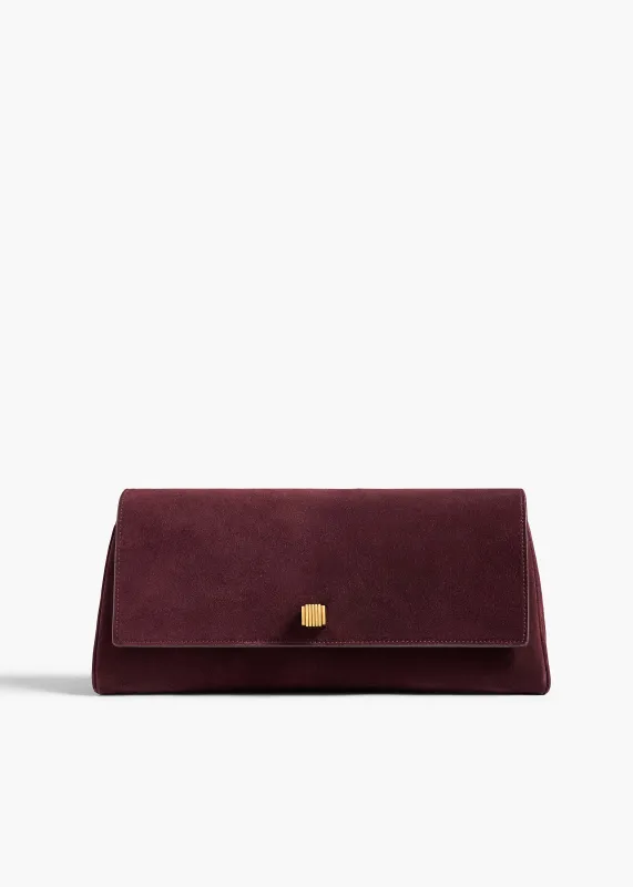 Audrey Clutch in Rouge Noir Suede made by KHAITE