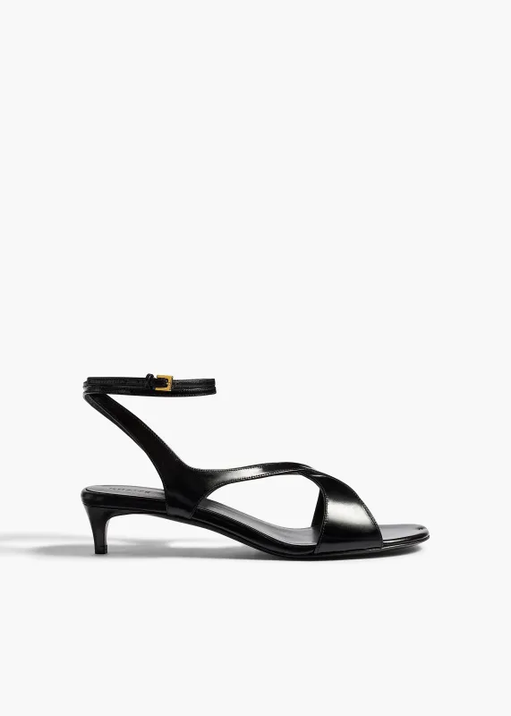 Liria Ankle Strap Sandal in Black Glazed Leather made by KHAITE