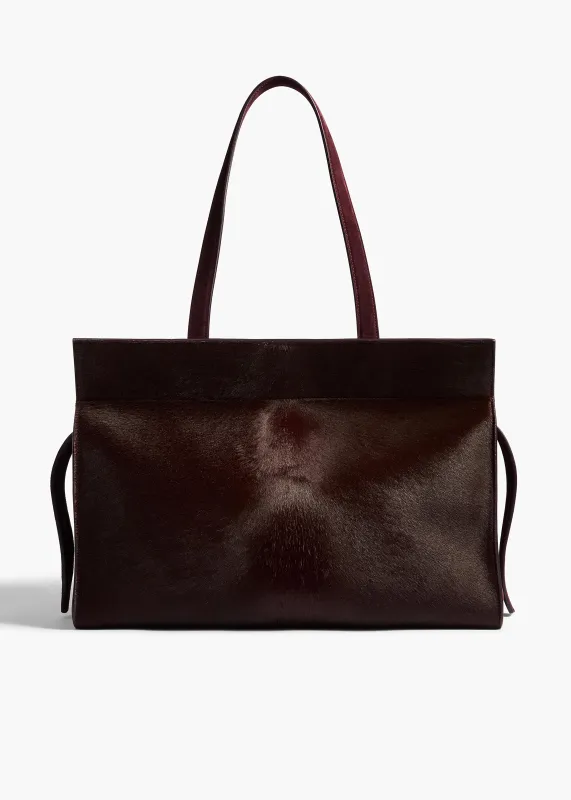Crosby Bag in Rouge Noir Suede made by KHAITE