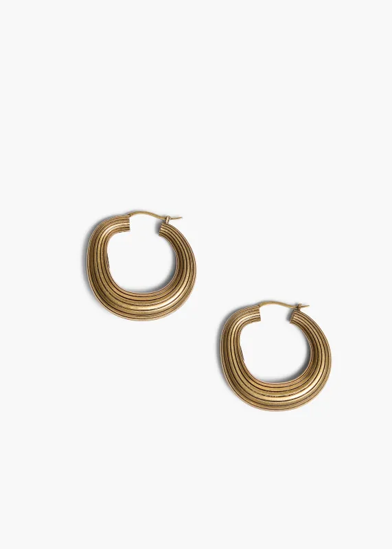 Santa Fe Hoop Earrings in Antique Gold made by KHAITE