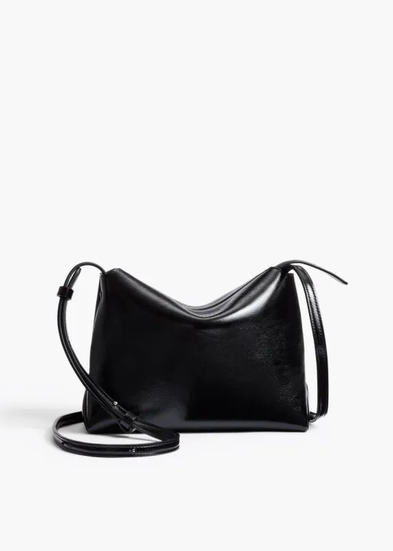 Lina Crossbody Bag in Black Crackle Patent Leather sold by KHAITE