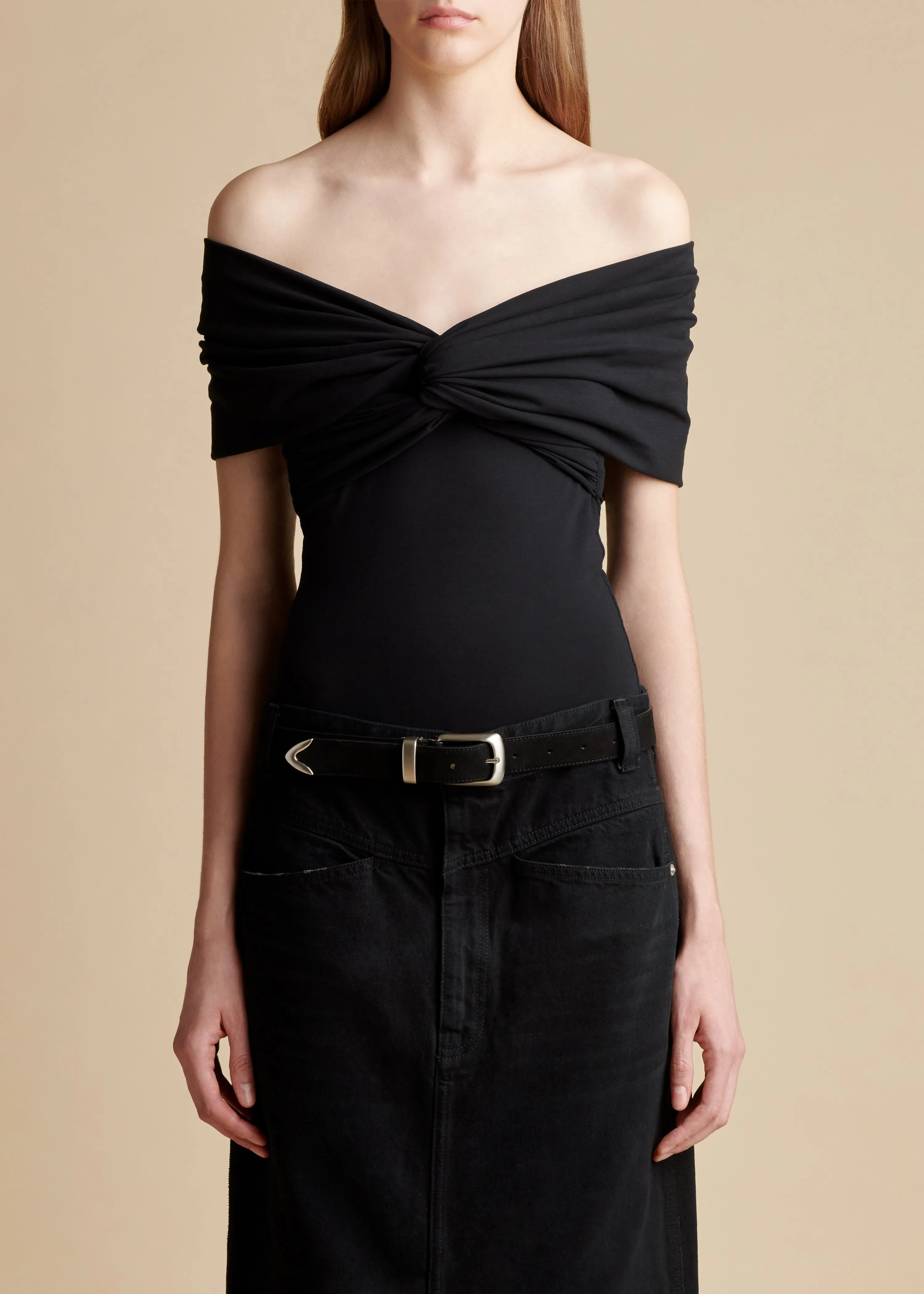 The Cerise Bodysuit in Black sold by KHAITE