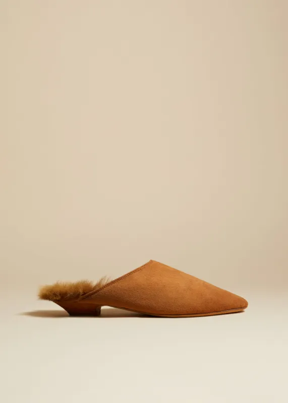 The Otto Mule in Nougat Suede with Shearling sold by KHAITE