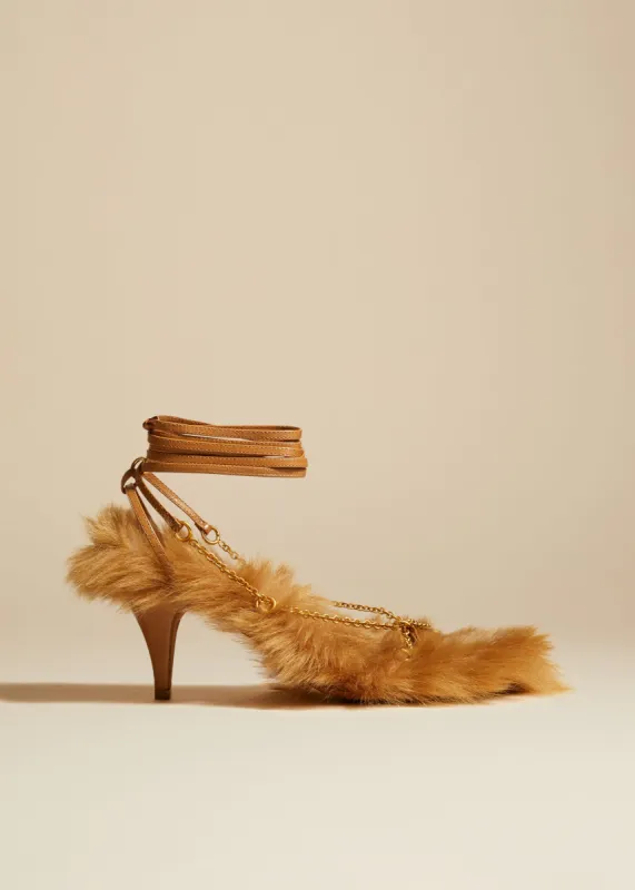 The Marion Sandal in Nougat Shearling with Chains sold by KHAITE