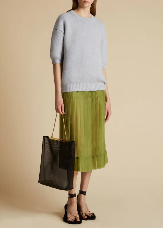 The Tudi Skirt in Green sold by KHAITE